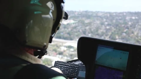 Cockpit view U.S. Customs Border Protection pilot flying AS350 A-Star helicopter Stock Footage 301077973
