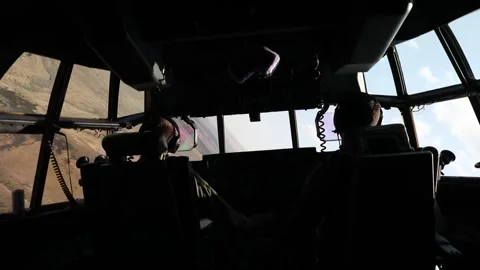 Cockpit view U.S. Marines KC-130 Super Hercules pilot low altitude flight Video stock 282784415