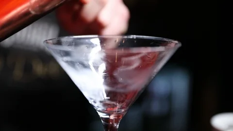 Cocktail being poured from shaker Stock Footage 102010328