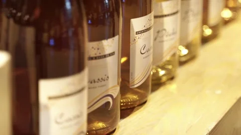 Cocktail bottles of alcoholic drinks from focus to out of focus at the front Stock Footage 268515720