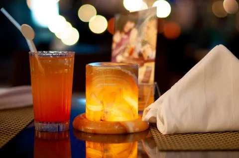 Cocktail candle and napkin serving table Stock Photos