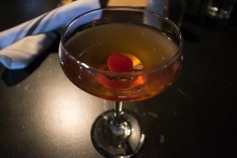 A cocktail with a cherry in it Stock Photos