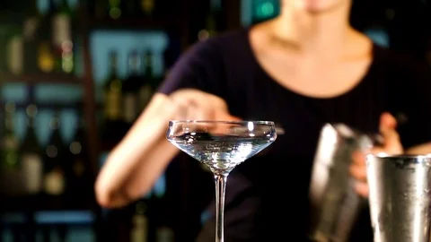 The Cocktail Is Cosmopolitan. Bartender preparing a cocktail Stock Footage 102403979