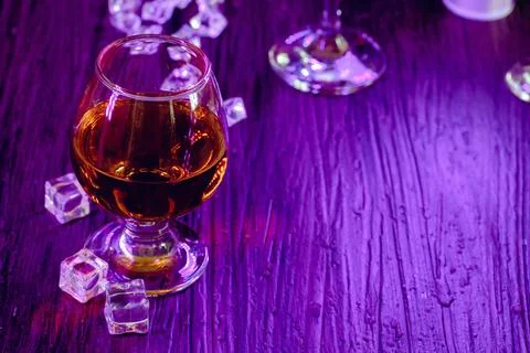 Cocktail drinks with ice in club lights Stock Photos