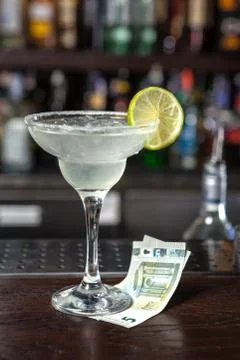 Cocktail garnished with lime. Stock Photos
