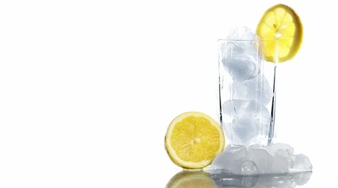 Cocktail In A Glass Adding Ice Tonic Water And A Slice Of Lime on white Stock Footage 65113931