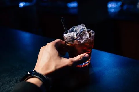Cocktail in hand Stock Photos