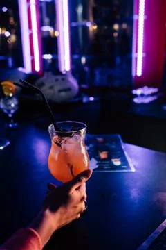 Cocktail in hand Stock Photos