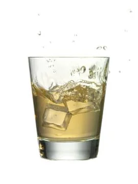 Cocktail with an ice cube Stock Photos