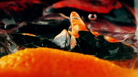 Cocktail with ice cubes and orange in the glass, closeup Stock Footage 65366827