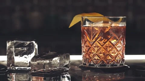 Cocktail with ice cubes on the bar Stock Footage 119847405