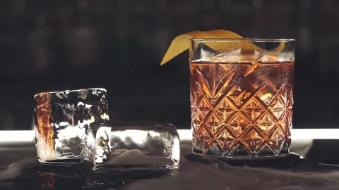 Cocktail with ice cubes on the bar Stock Footage 121798350