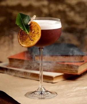 Cocktail with lemon slice on the table Stock Photos
