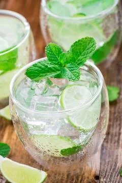 Cocktail with lime and mint Stock Photos