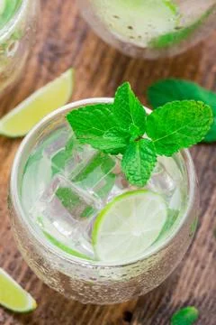 Cocktail with lime and mint Stock Photos