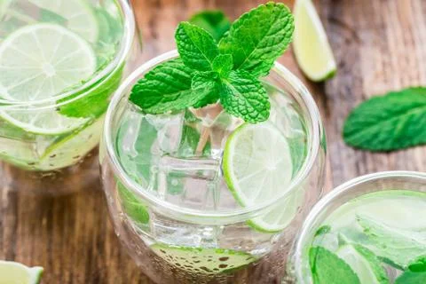 Cocktail with lime and mint Stock Photos