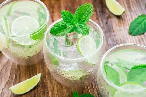 Cocktail with lime and mint Stock Photos