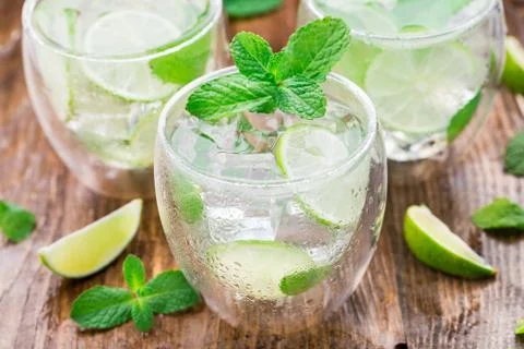 Cocktail with lime and mint Stock Photos
