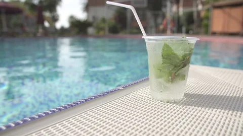 Cocktail Mojito close-up on the background of the pool Stock Footage 97603797