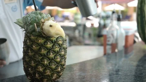 Cocktail is poured into pineapple Video stock 107891483