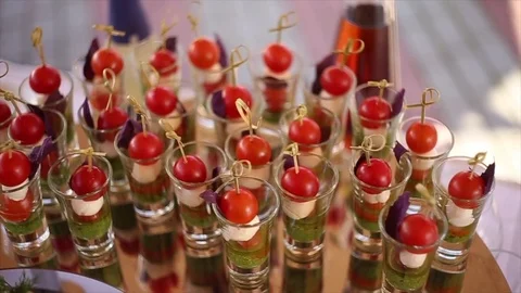 Cocktail snacks with cherry tomatoes Stock Footage 83690495