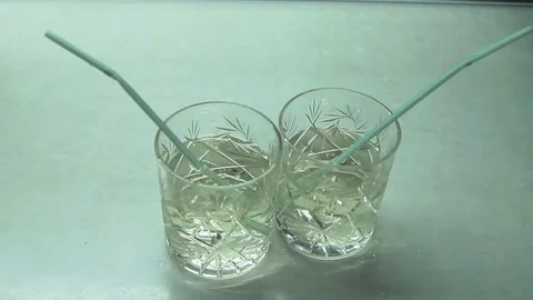Cocktail with a straw on the table Stock Footage 108116023