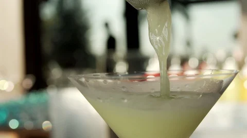 Cocktail sunset pour close up Stock Footage 103799145
