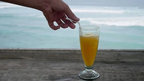 Cocktail on the table overlooking the ocean or sea. The concept of leisure and Stock-Footage 82531628