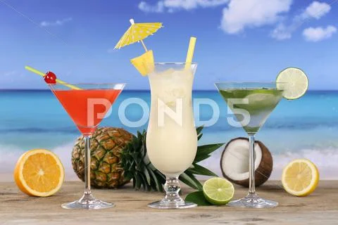 Cocktails and drinks on the beach and sea Stock Photos