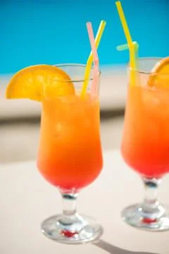 Cocktails on the background of the pool. Stock Photos