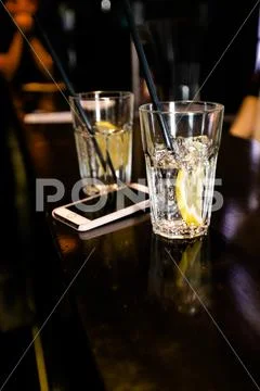 Cocktails by a barmen in a nightclub - Bartender skills are shown Stock Photos