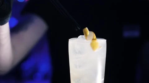 Cocktails. bartender job. The bartender insert the tube straws. Agility. Art Stock Footage 141643671