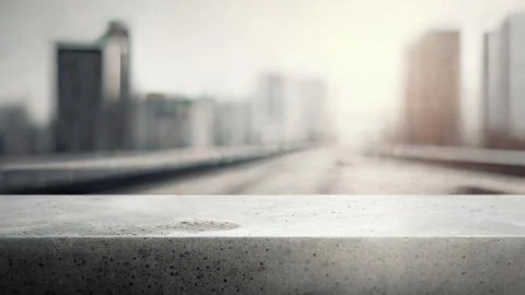 Cocnrete table with blurred city on back Ilustración de archivo