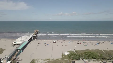 Coco Beach Aerial Drone Pan Looking Towards Pier Video stock 229499179