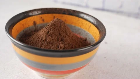 Coco powder in a bowl on table, Stock Footage 158434059