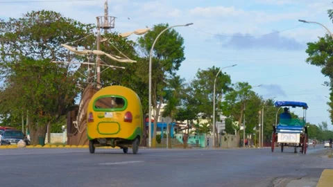 Coco yellow moto rickshaw on Cuba resort Stock-Footage 332074138
