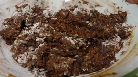 Cocoa added to the dough turns it rich brown Stock Footage 320067525