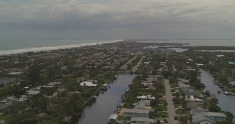 Cocoa Beach Florida Aerial v1 panning shot across the residences and beach Stock Footage