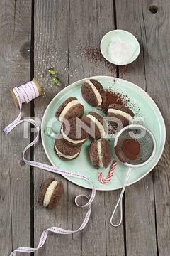 Cocoa biscuits filled with coconut cream Stock Photos