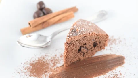 Cocoa Cake with cinnamon and chocolates on white background Stock Footage 85820015