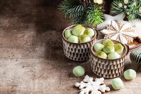Cocoa with marshmallow in a ceramic cups and homemade gingerbread snowflakes. Stock Photos