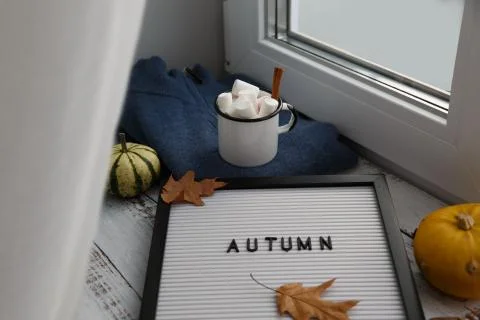 Cocoa with marshmallows stands on a windowsill Stock Photos
