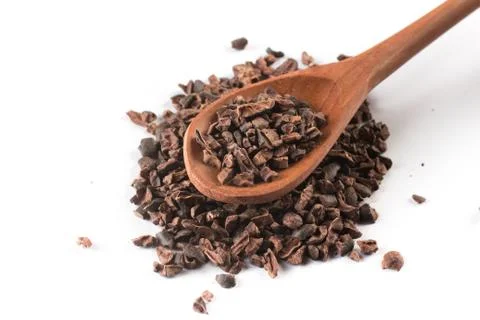 Cocoa Nibs into a spoon Stock Photos