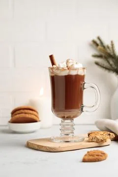 Cocoa or hot chocolate with marshmallows in a tall mug, on a wooden stand with Stock Photos