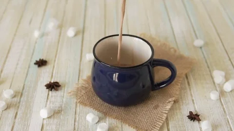 Cocoa is pouring into a mug. Stock Footage 83332703