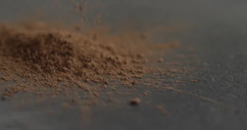 Cocoa powder is falling onto the mountain cocoa Stock Footage 198147282