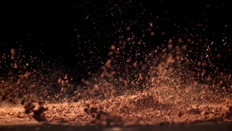 Cocoa powder falls on the table. Filmed on a high-speed camera at 1000 fps. Stock Footage 308474226
