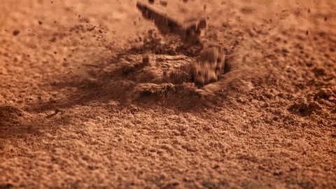 Cocoa powder falls on the table. Filmed on a high-speed camera at 1000 fps. Stock Footage 309216359