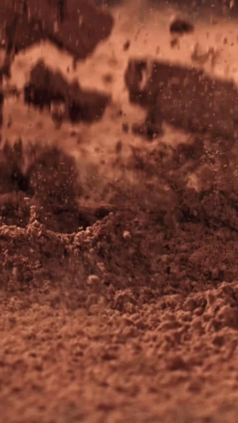 Cocoa powder falls on the table. Filmed on a high-speed camera at 1000 fps Stock Footage 335366161