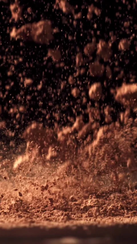 Cocoa powder falls on the table. Filmed on a high-speed camera at 1000 fps Stock Footage 335366918